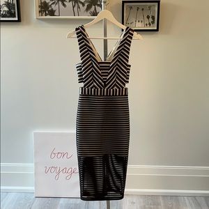 MIDI dress with back zip and cut outs.